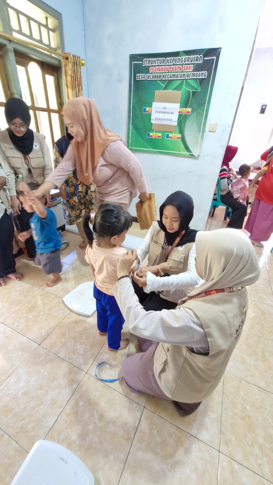 Pemasangan Plang Penunjuk Kegiatan Posyandu Puspa Sari