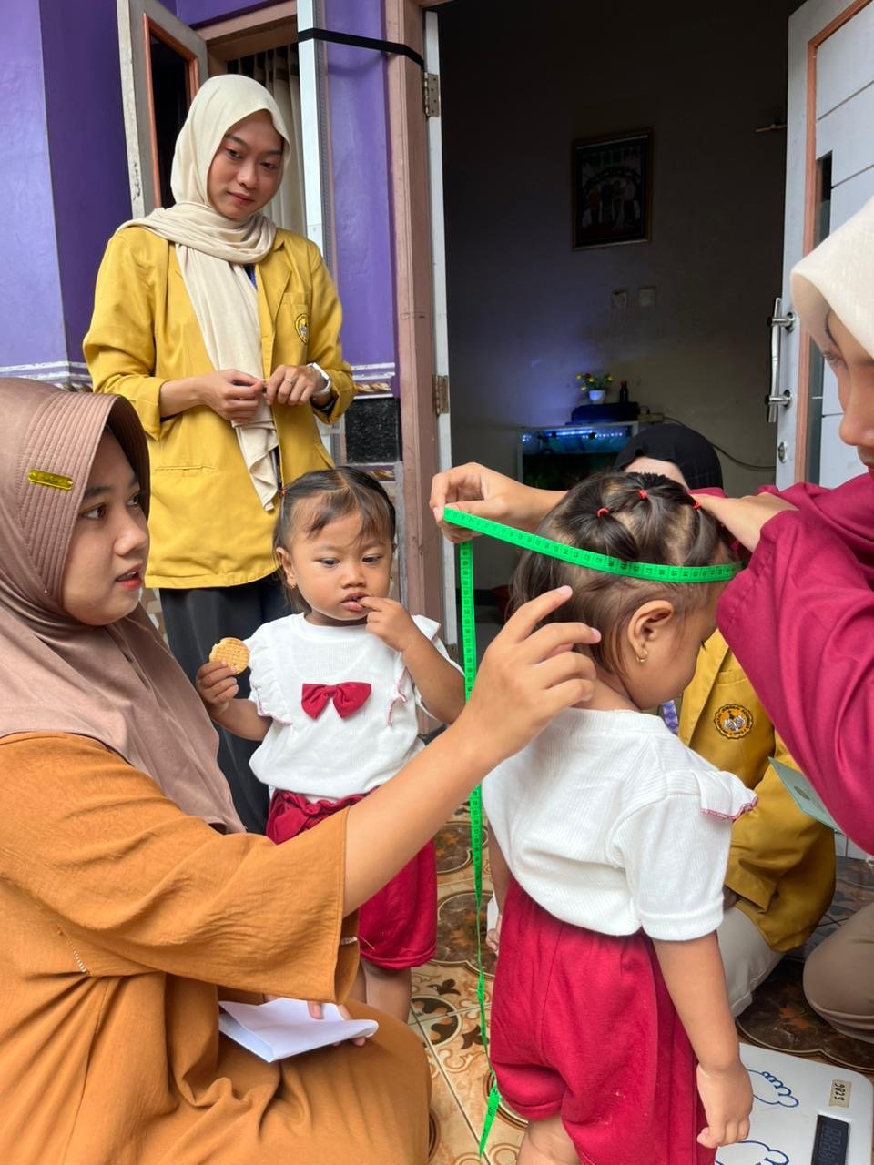 pendampingan posyandu dan pembuatan plang posko unsoed