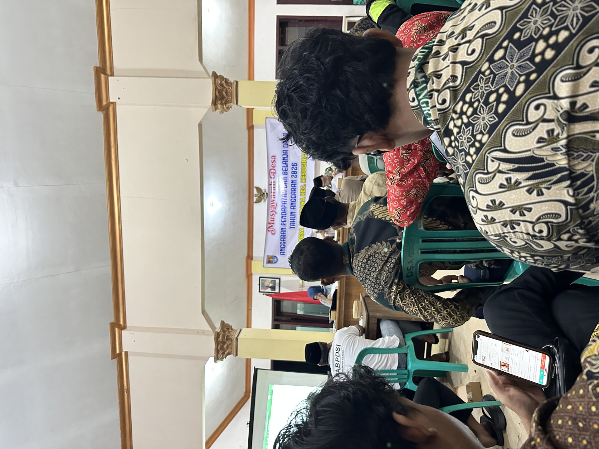 Menghadiri Musyawarah Desa