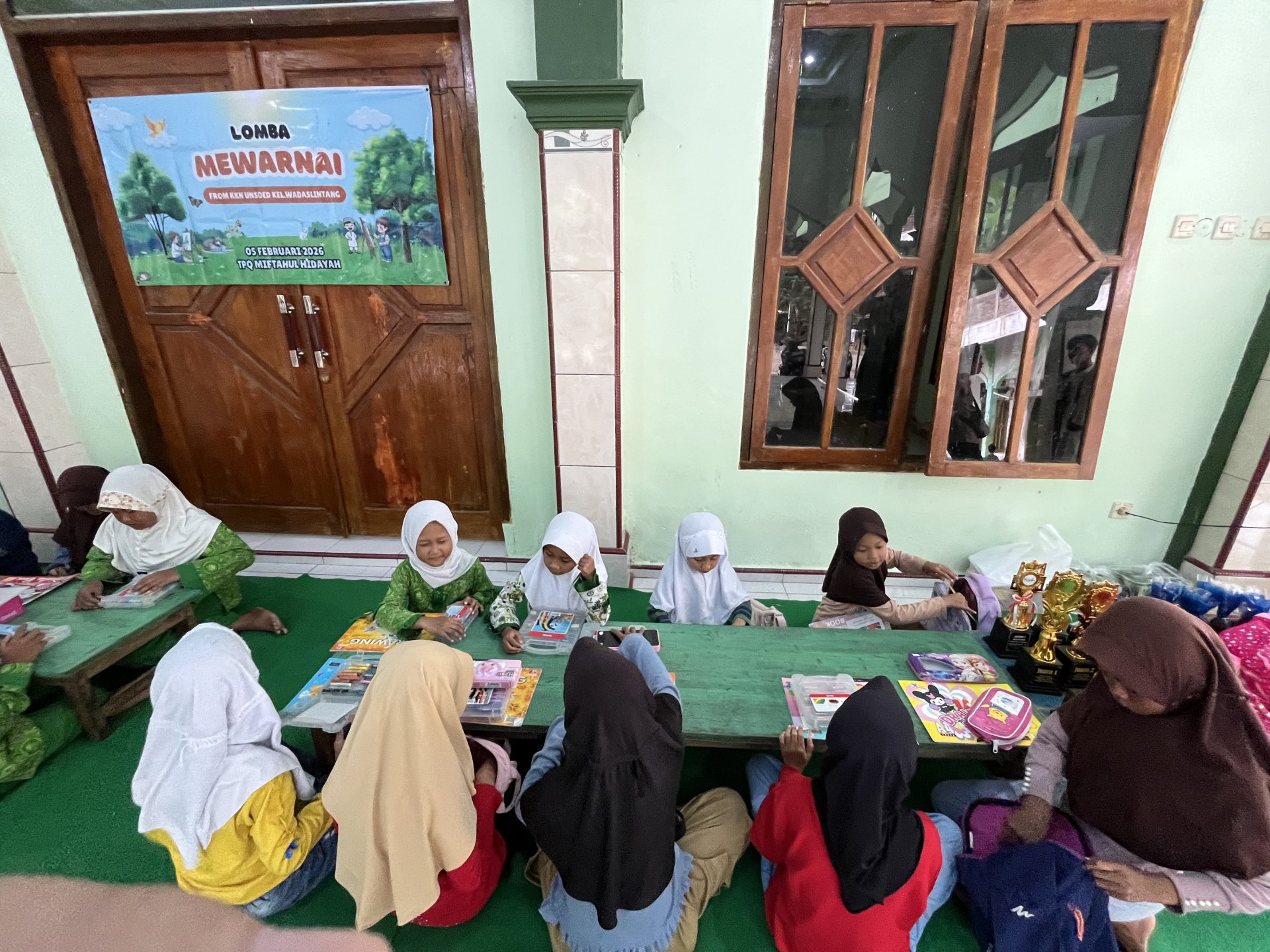 Kegiatan Pendampingan Lomba Mewarnai di TPQ Miftahul Hidayah